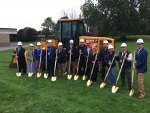 Batavia City SD officials, Campus CMG team members, and NYS Assemblyman Stephen Hawley pose with golden shovels.